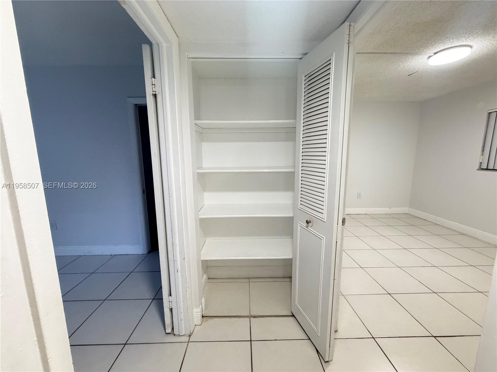 8760 Southwest 133rd Avenue Road, Unit 217 Miami, FL 33183 - Photo 9 of 10 a view of an empty walk in closet