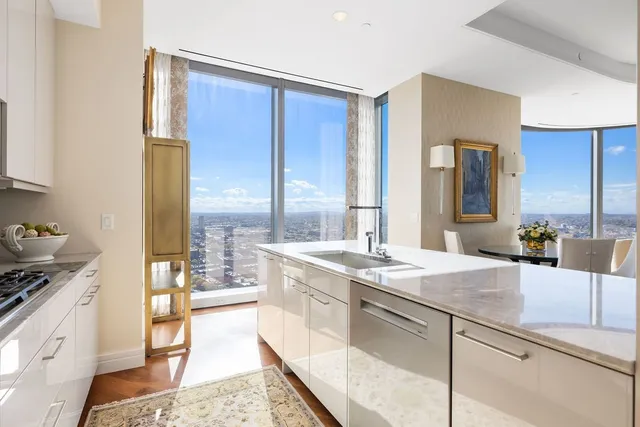 a spacious bathroom with a granite countertop sink and a mirror