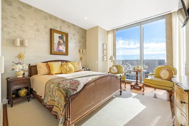 a bed room with a bed and a table