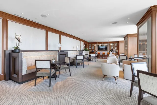 a living room with furniture a table and chairs