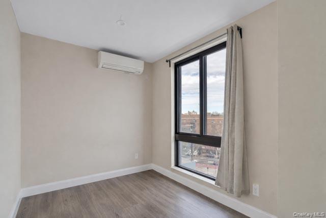 45-16 83rd Street, Unit E8F Queens, NY 11373 - Photo 15 of 19 a view of an empty room with window