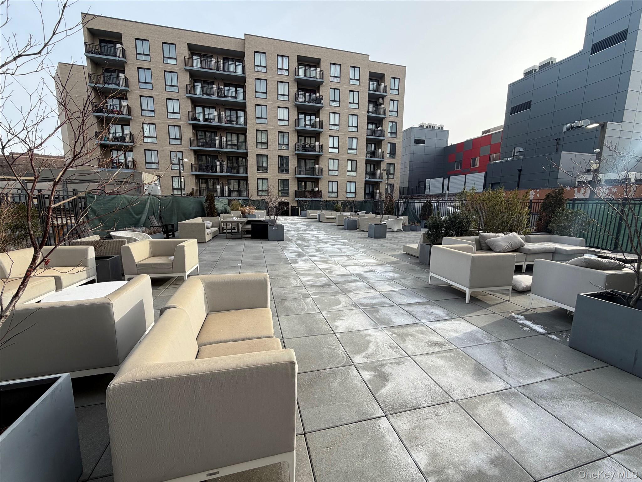 45-16 83rd Street, Unit E8F Queens, NY 11373 - Photo 19 of 19 a building outdoor space with patio furniture