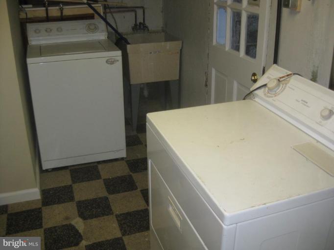 59 Hawthorne Road Middle River, MD 21220 - Photo 14 of 18 a utility room with dryer and washer