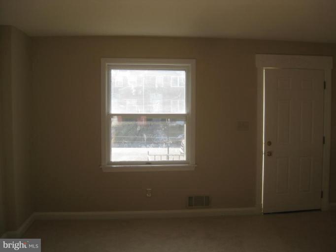 59 Hawthorne Road Middle River, MD 21220 - Photo 4 of 18 a view of an empty room with a window