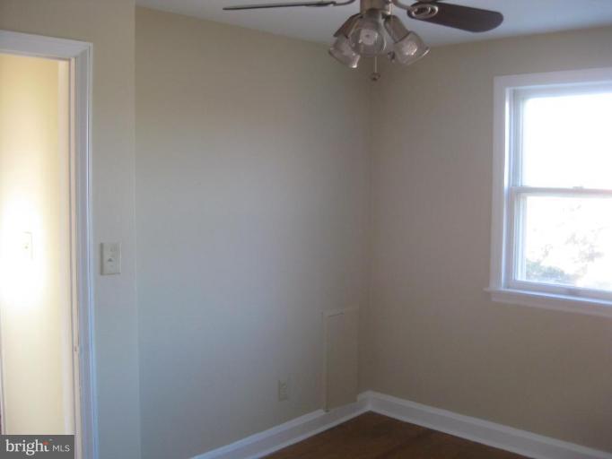 59 Hawthorne Road Middle River, MD 21220 - Photo 7 of 18 an empty room with a window