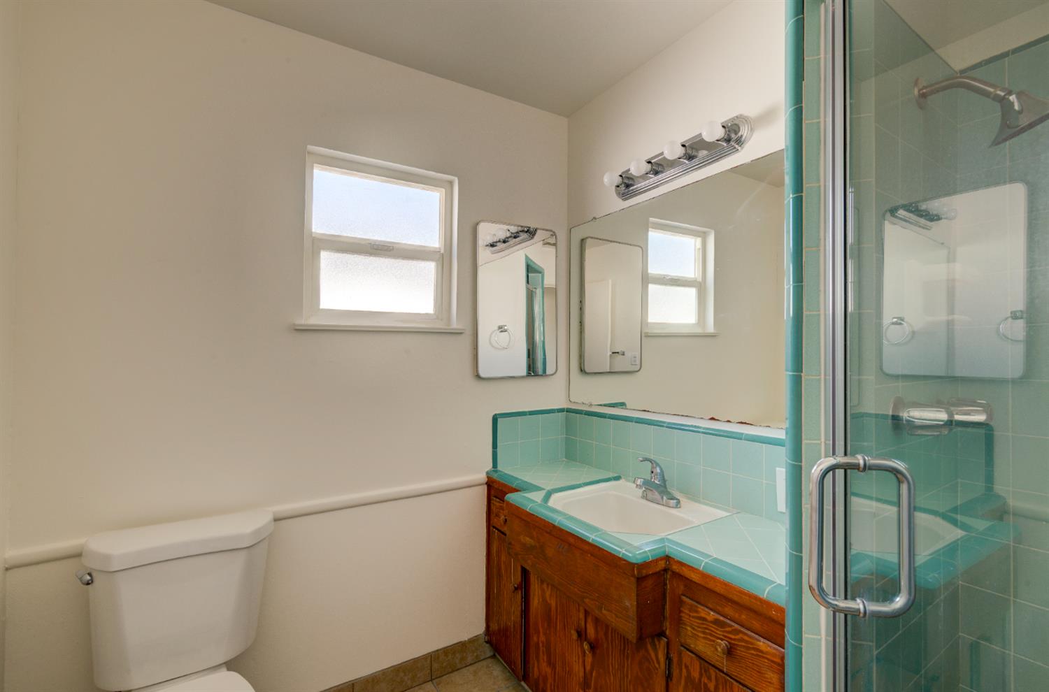 4722 North Callisch Street Fresno, CA 93726 - Photo 21 of 37 a bathroom with a sink and a mirror