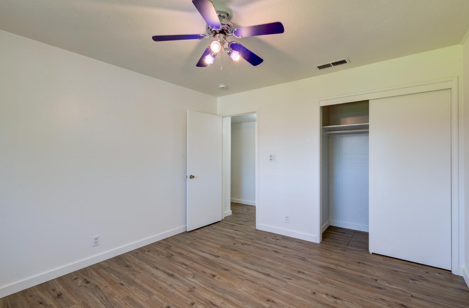4722 North Callisch Street Fresno, CA 93726 - Photo 25 of 37 a view of an empty room with wooden floor