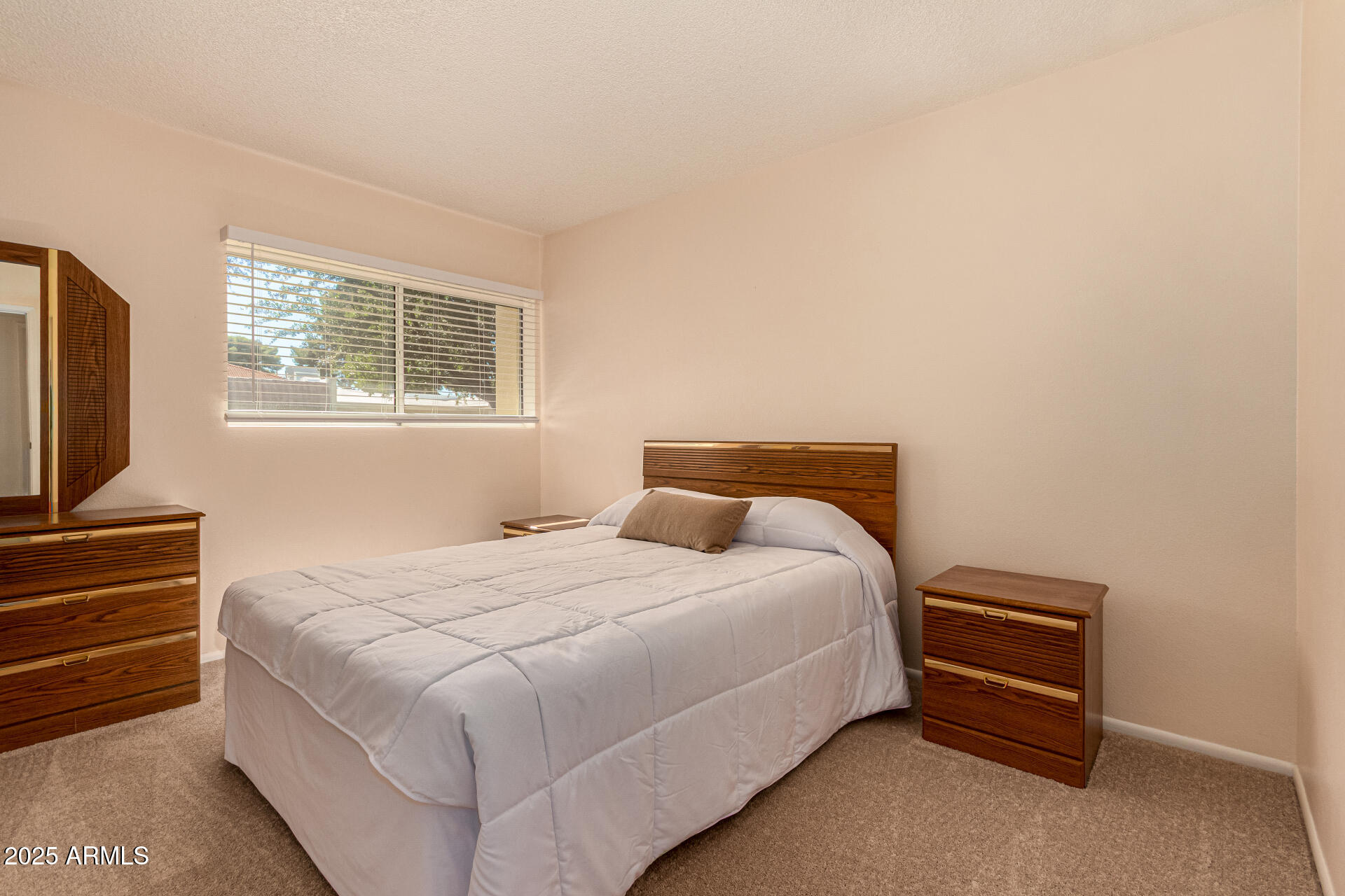 641 South Power Road, Unit 364 Mesa, AZ 85206 - Photo 16 of 32 a bedroom with a bed and a flat screen tv