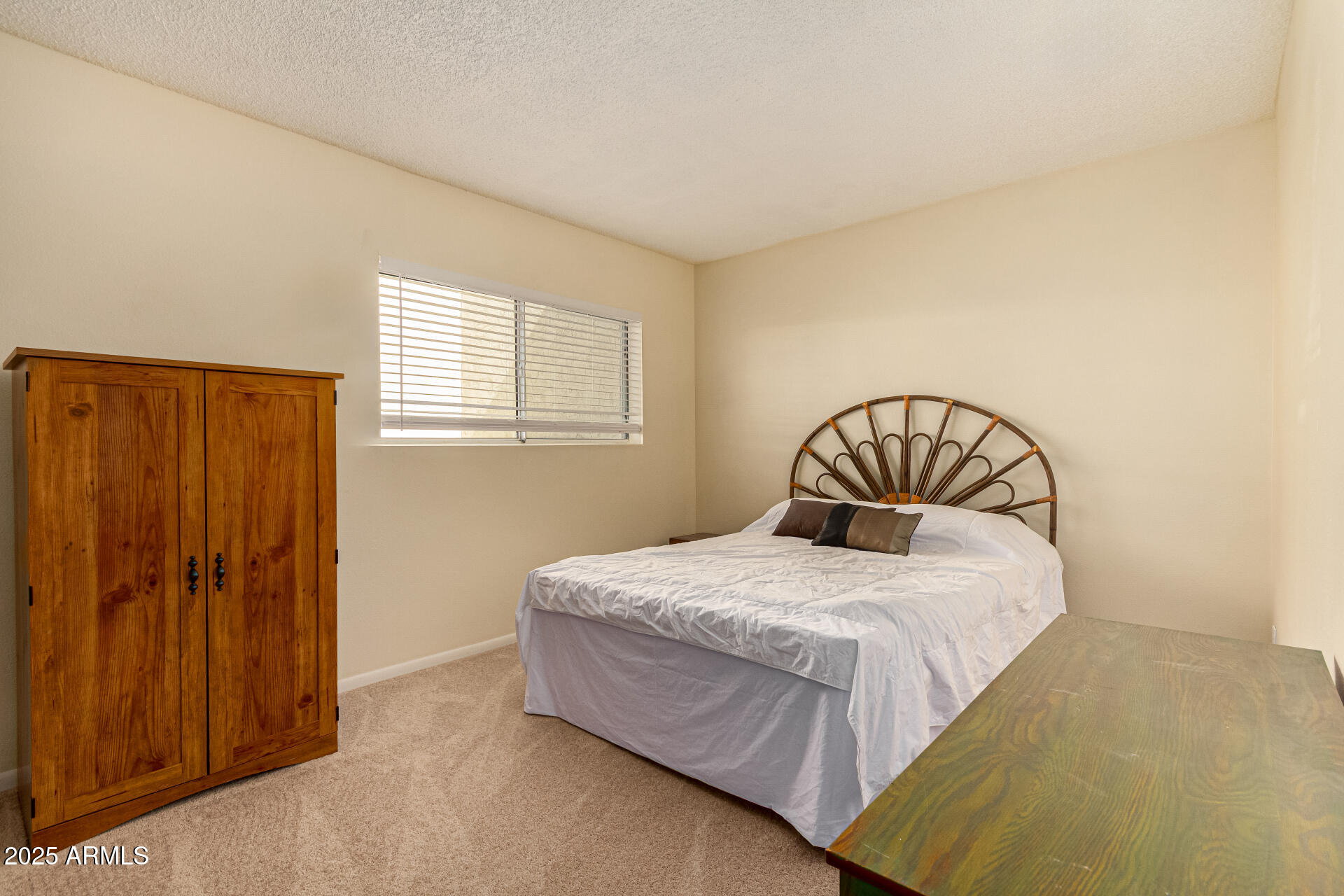 641 South Power Road, Unit 364 Mesa, AZ 85206 - Photo 21 of 32 a bedroom with a bed and a window