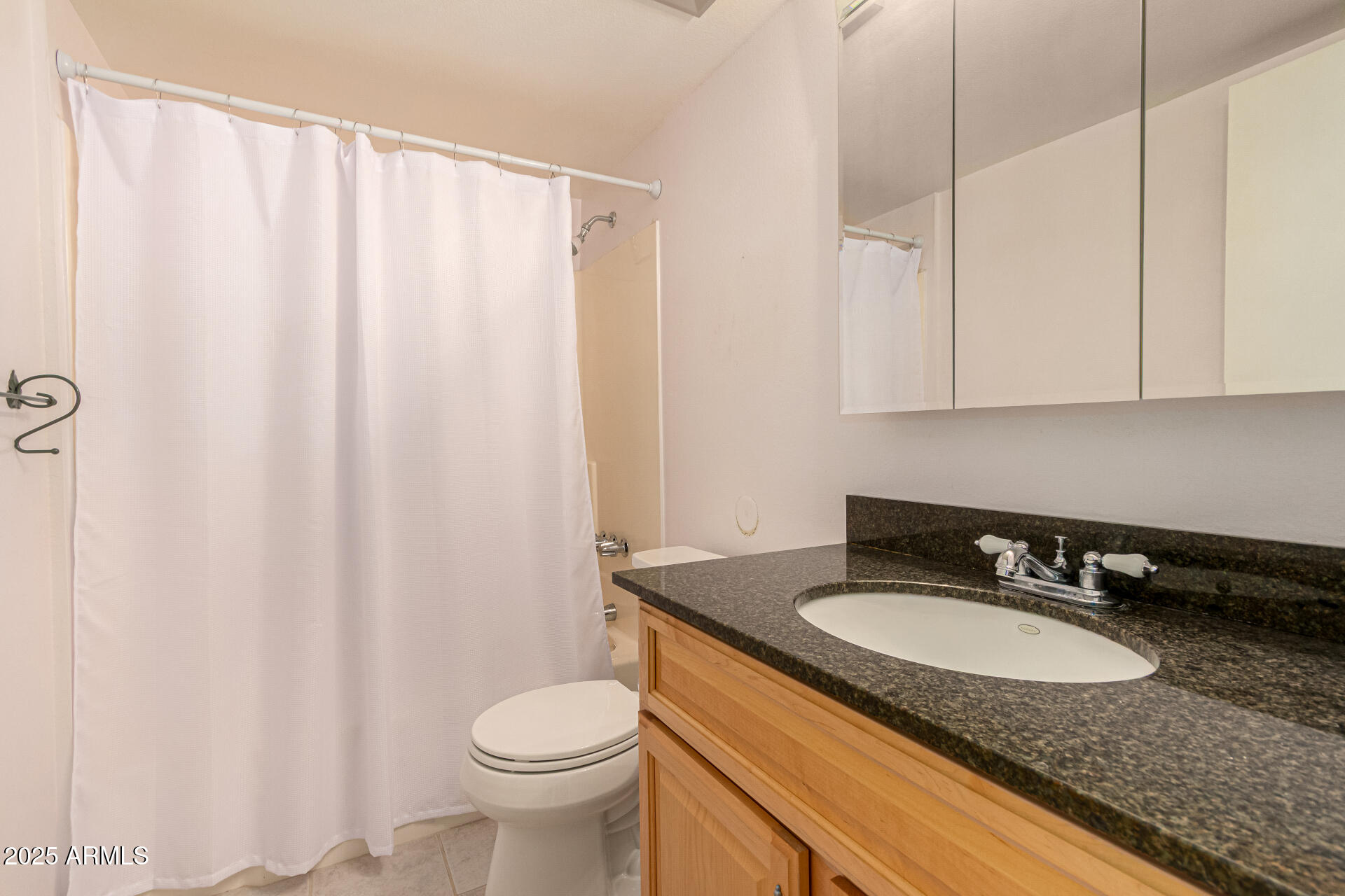 641 South Power Road, Unit 364 Mesa, AZ 85206 - Photo 23 of 32 a bathroom with a granite countertop sink and a mirror
