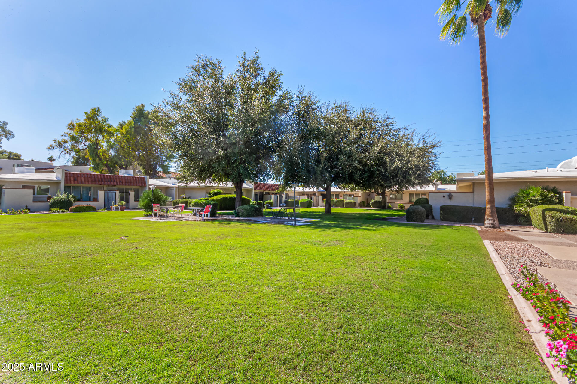 641 South Power Road, Unit 364 Mesa, AZ 85206 - Photo 30 of 32 a view of a house with garden and trees