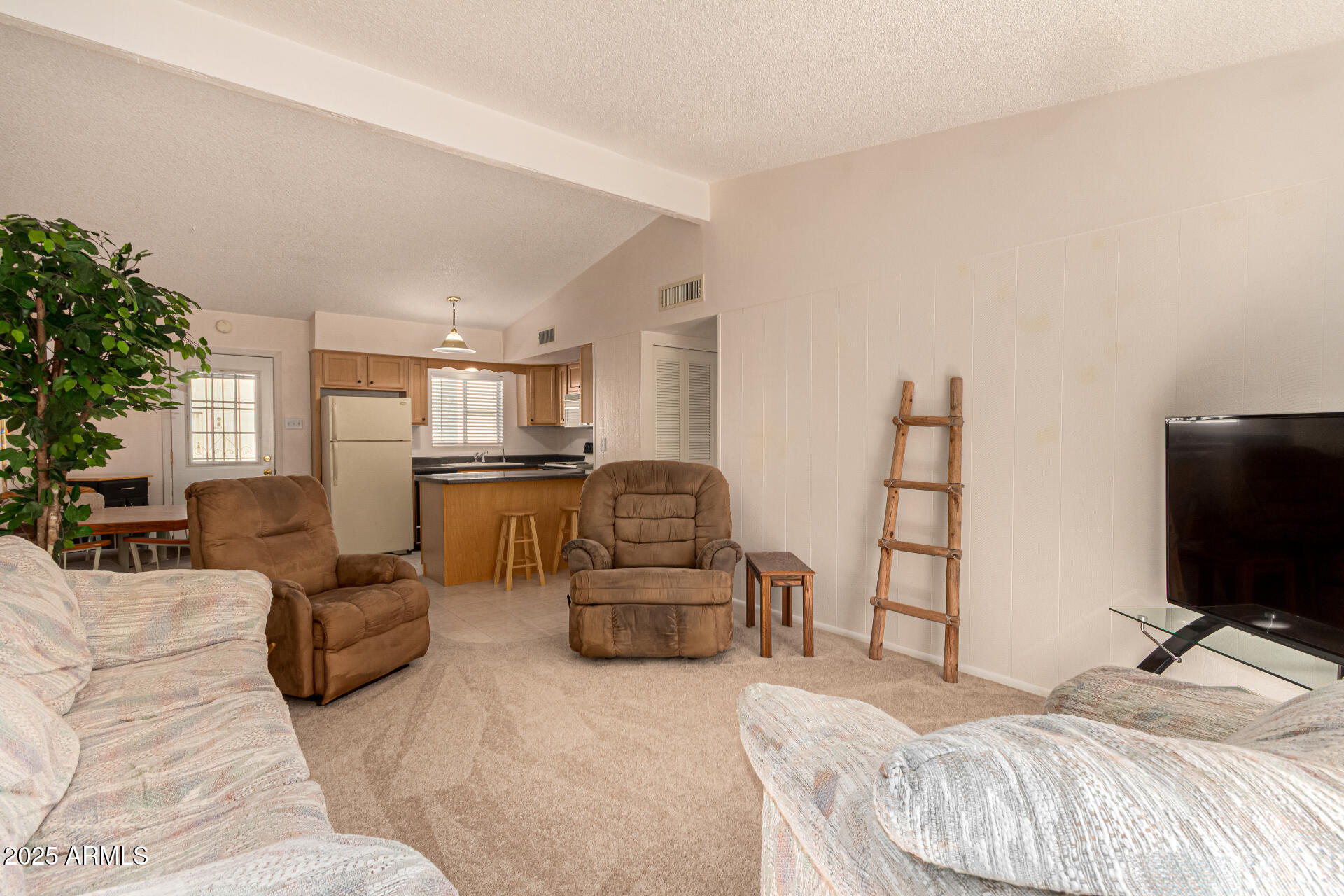 641 South Power Road, Unit 364 Mesa, AZ 85206 - Photo 5 of 32 a bedroom with furniture and a flat screen tv
