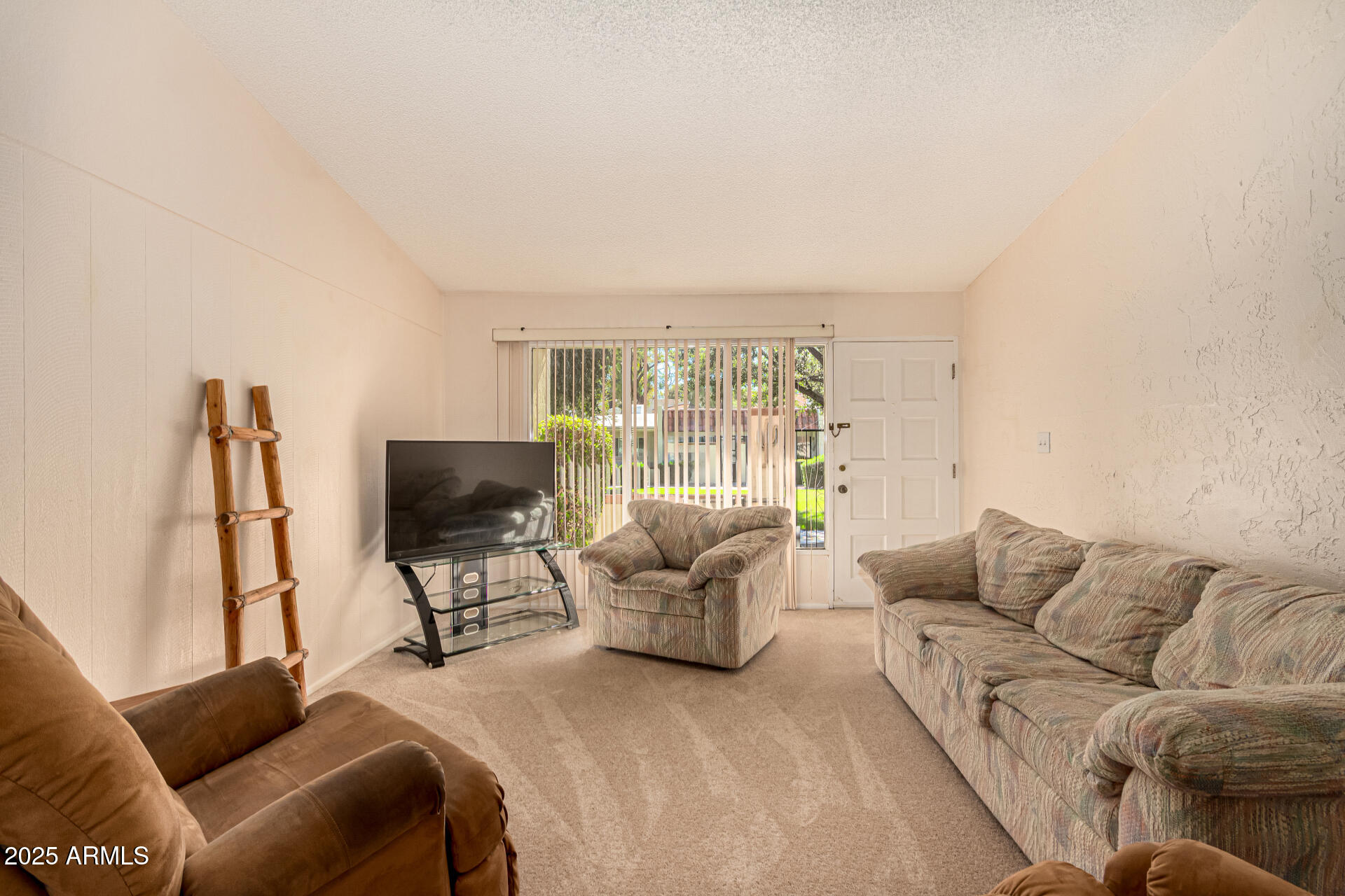 641 South Power Road, Unit 364 Mesa, AZ 85206 - Photo 8 of 32 a living room with furniture and a flat screen tv