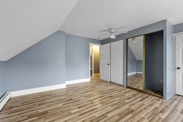 a view of entryway with wooden floor