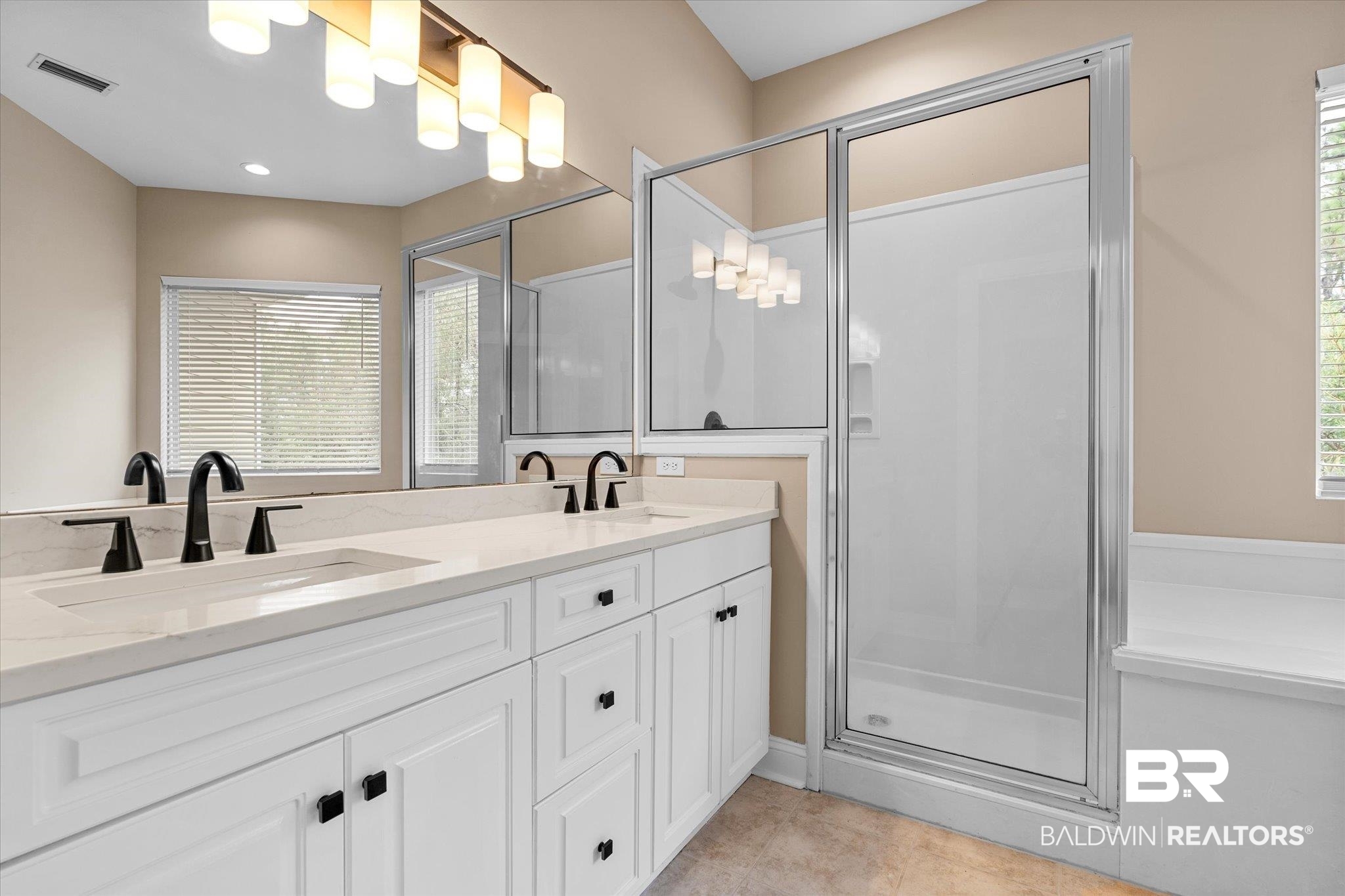 9259 Genipa Way Gulf Shores, AL 36542 - Photo 28 of 72 Bathroom featuring vanity and an enclosed shower