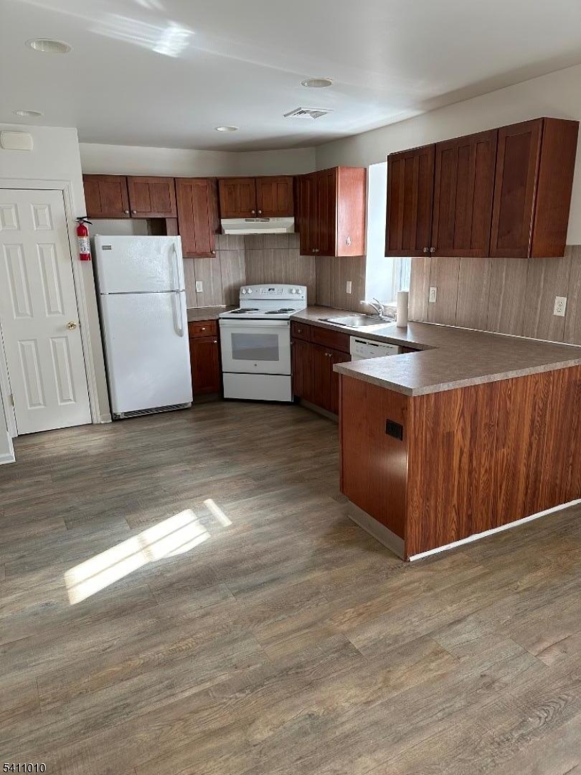 a kitchen with a cabinets and a sink