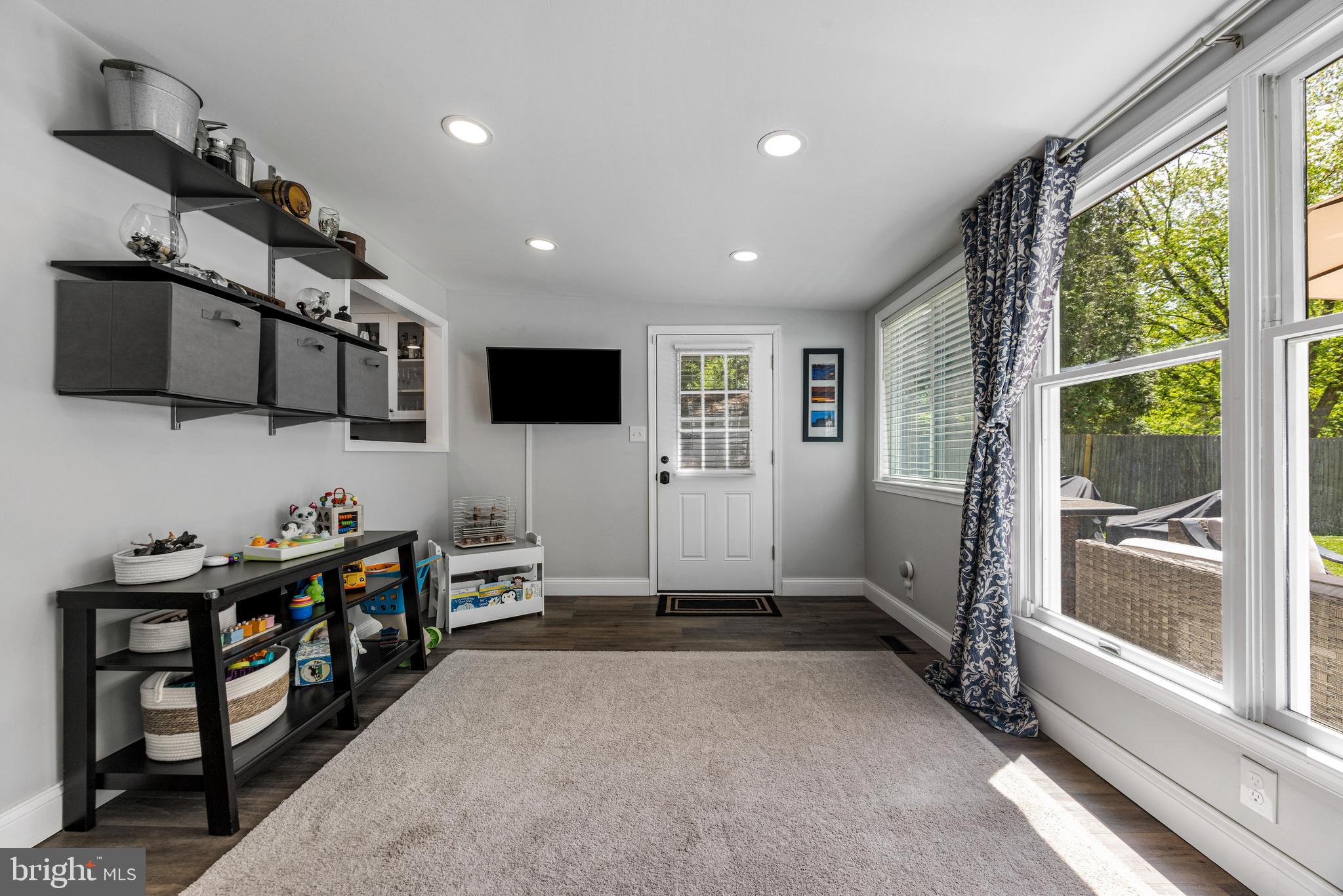 3006 Bass Place Riva, MD 21140 - Photo 22 of 51 a view of a room with gym equipment and a flat screen tv