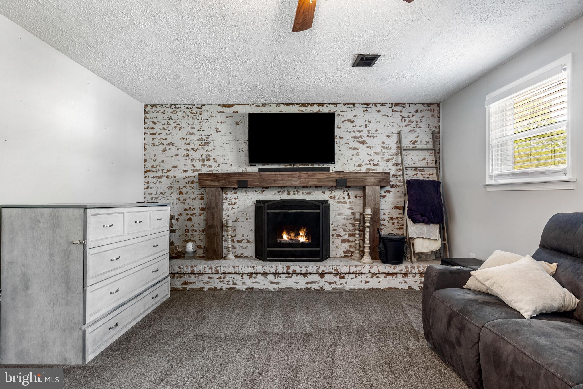 3006 Bass Place Riva, MD 21140 - Photo 24 of 51 a living room with furniture and a fireplace