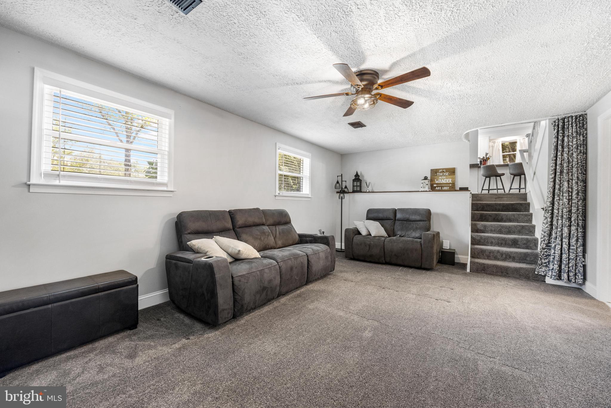 3006 Bass Place Riva, MD 21140 - Photo 25 of 51 a living room with furniture and a ceiling fan