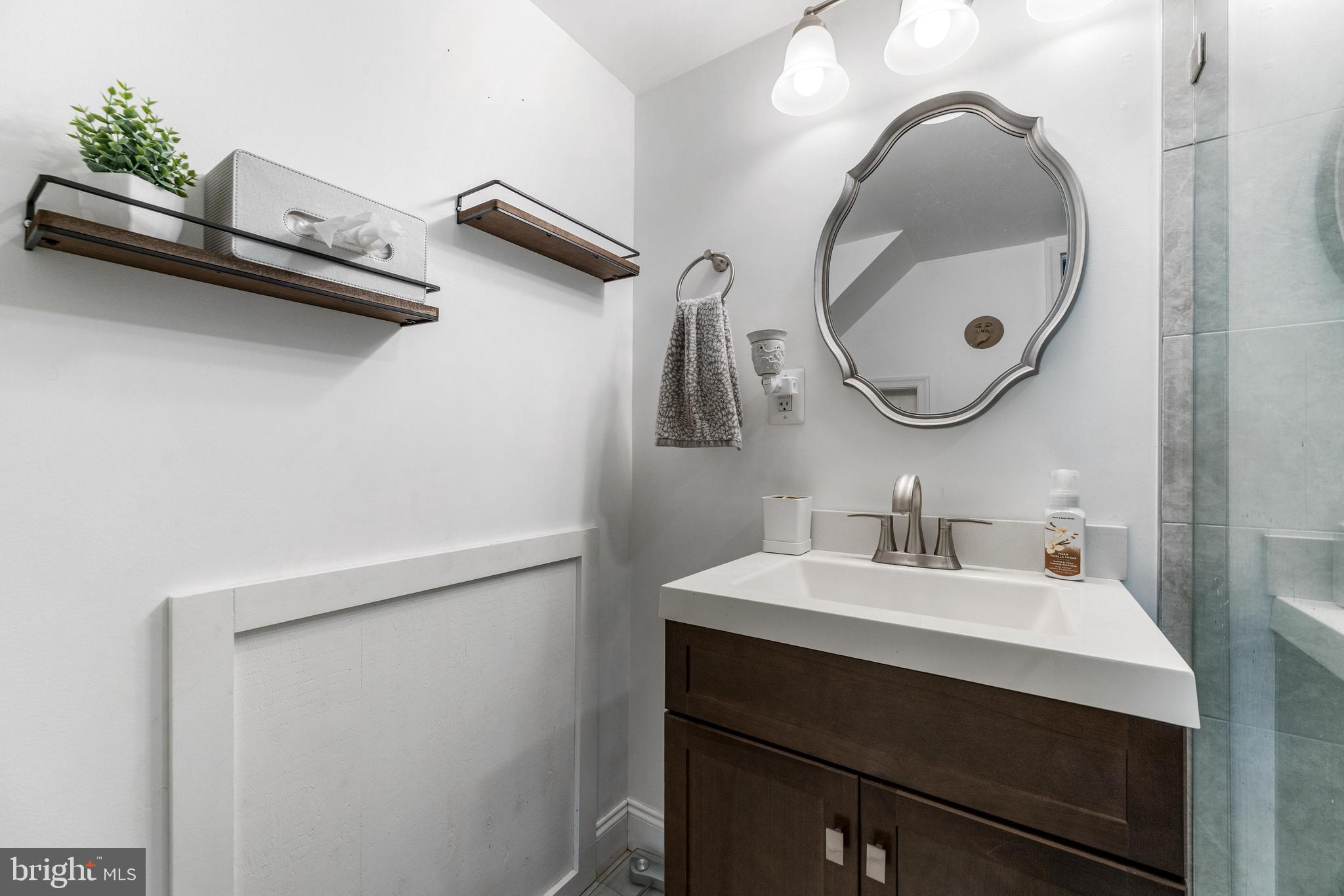 3006 Bass Place Riva, MD 21140 - Photo 27 of 51 a bathroom with a sink and a mirror
