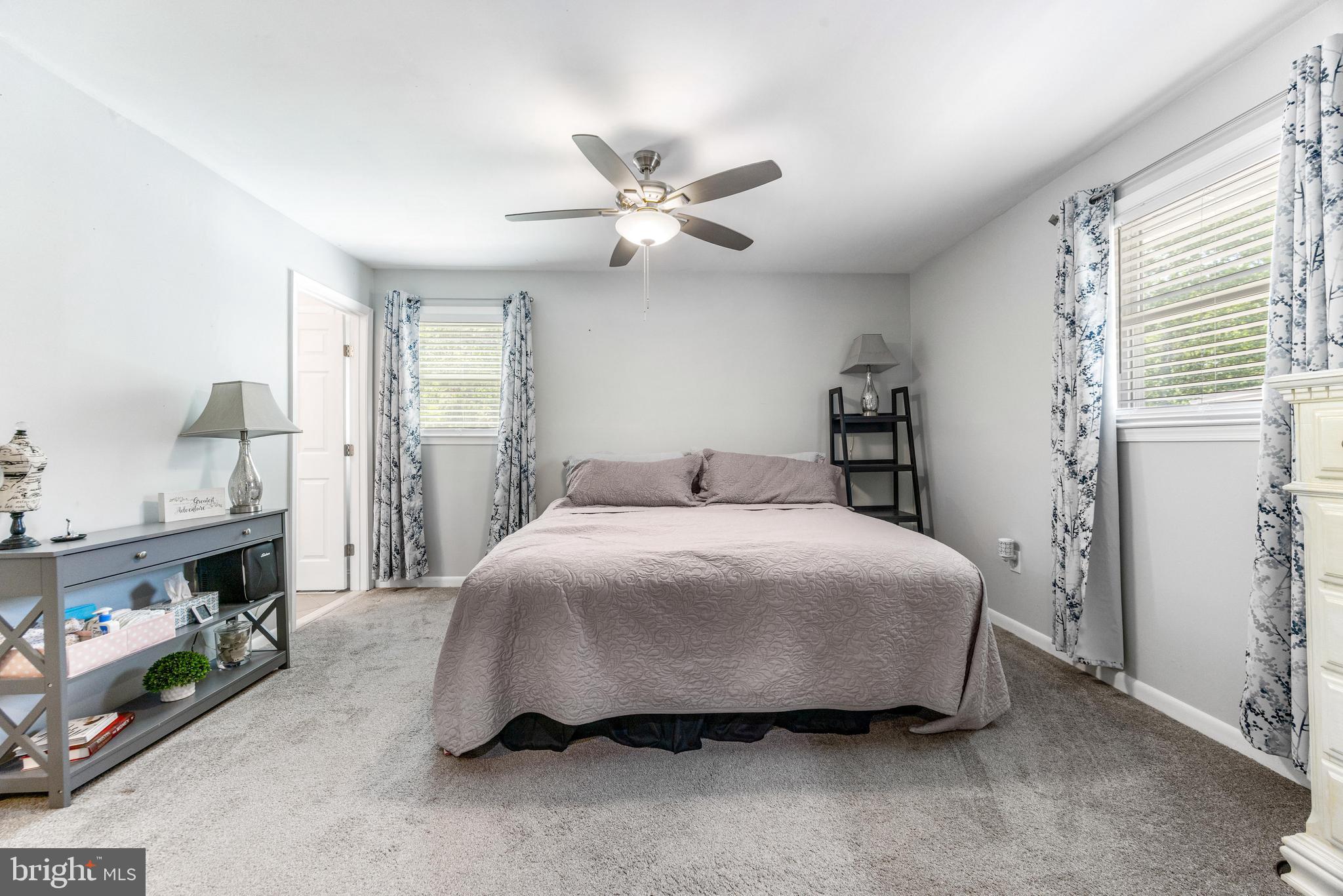 3006 Bass Place Riva, MD 21140 - Photo 30 of 51 a bedroom with a bed and a chandelier