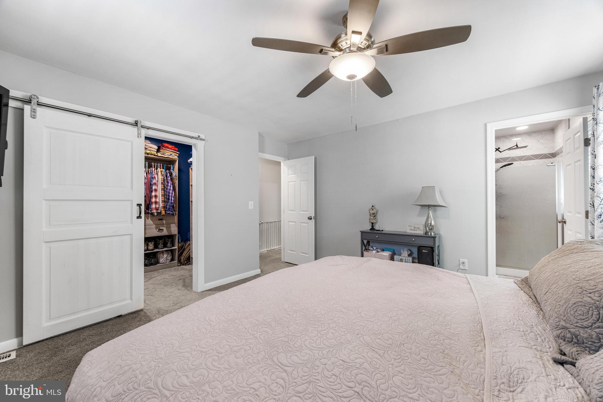 3006 Bass Place Riva, MD 21140 - Photo 31 of 51 a bedroom with a large bed and a chandelier