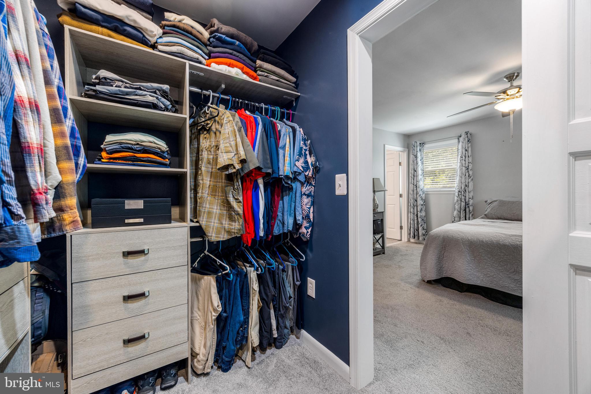 3006 Bass Place Riva, MD 21140 - Photo 34 of 51 a view of walk in closet with clothes and shoes