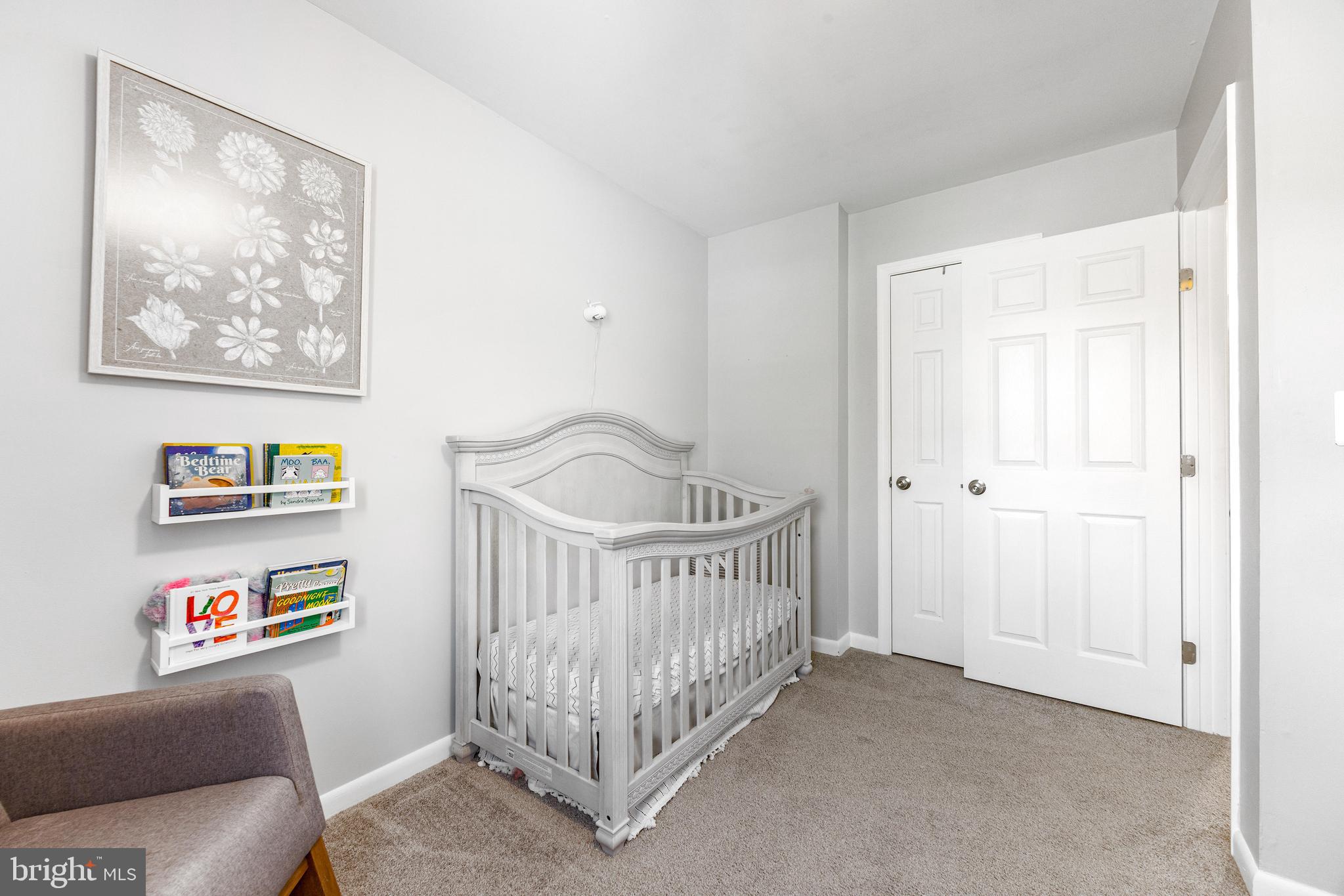 3006 Bass Place Riva, MD 21140 - Photo 38 of 51 a bedroom with a bed and book shelf