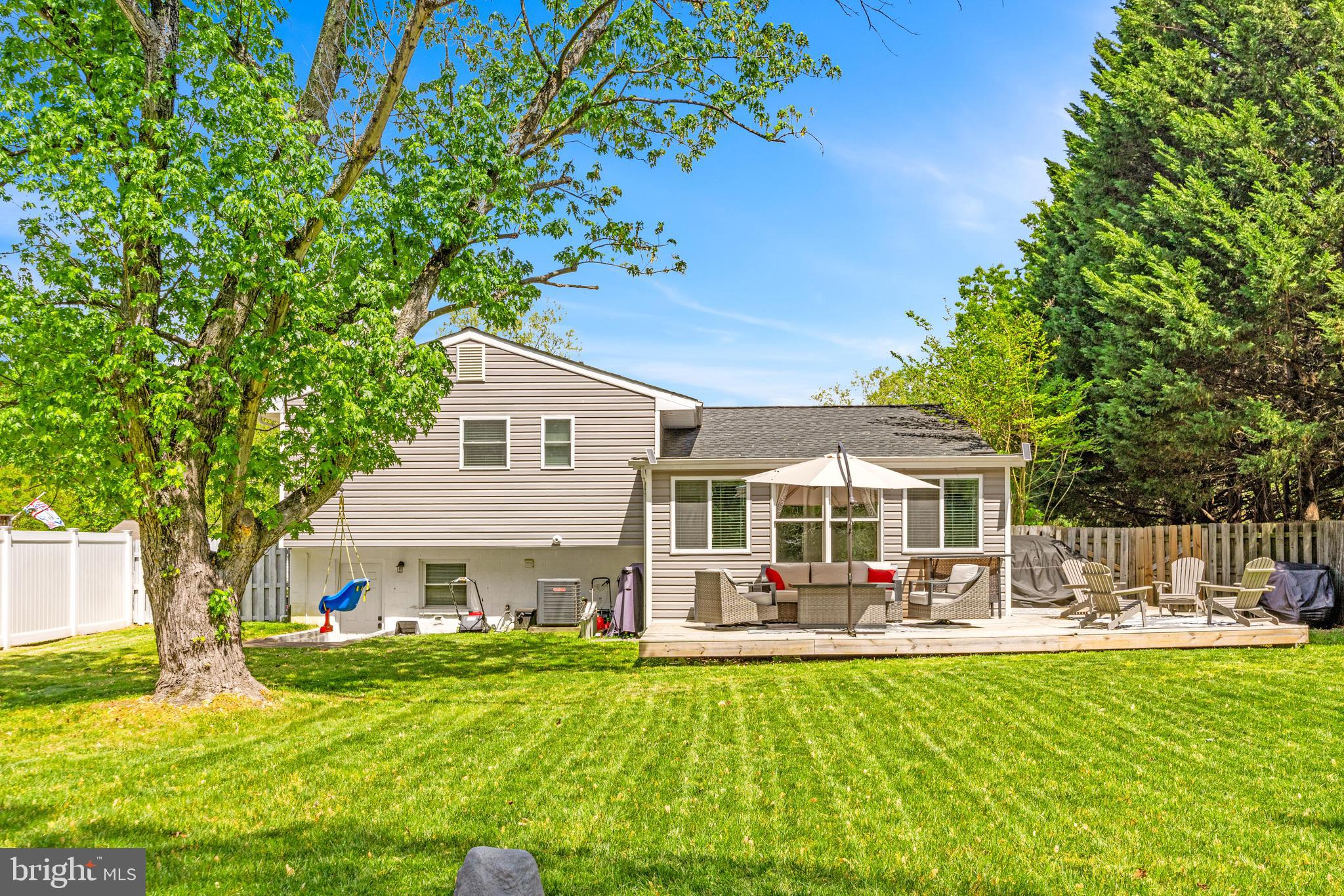 3006 Bass Place Riva, MD 21140 - Photo 47 of 51 a front view of a house with garden and trees