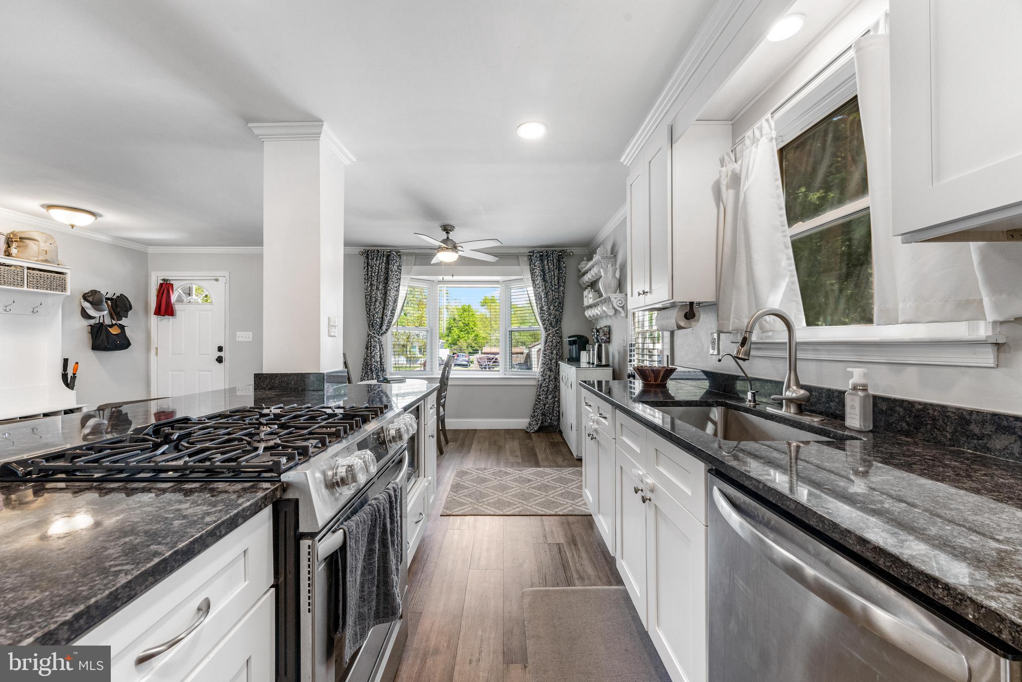 3006 Bass Place Riva, MD 21140 - Photo 6 of 51 a kitchen with stainless steel appliances a sink stove and cabinets