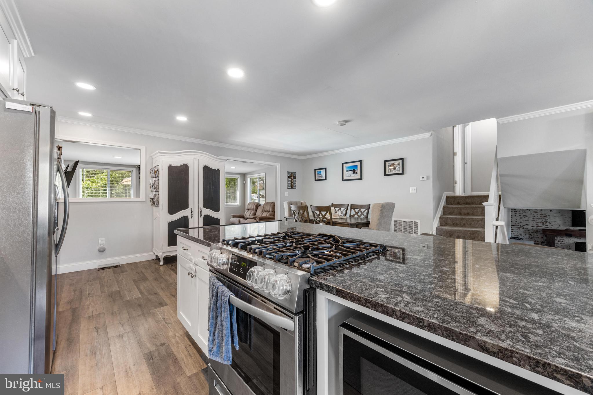 3006 Bass Place Riva, MD 21140 - Photo 7 of 51 a kitchen with stainless steel appliances granite countertop a stove and a sink