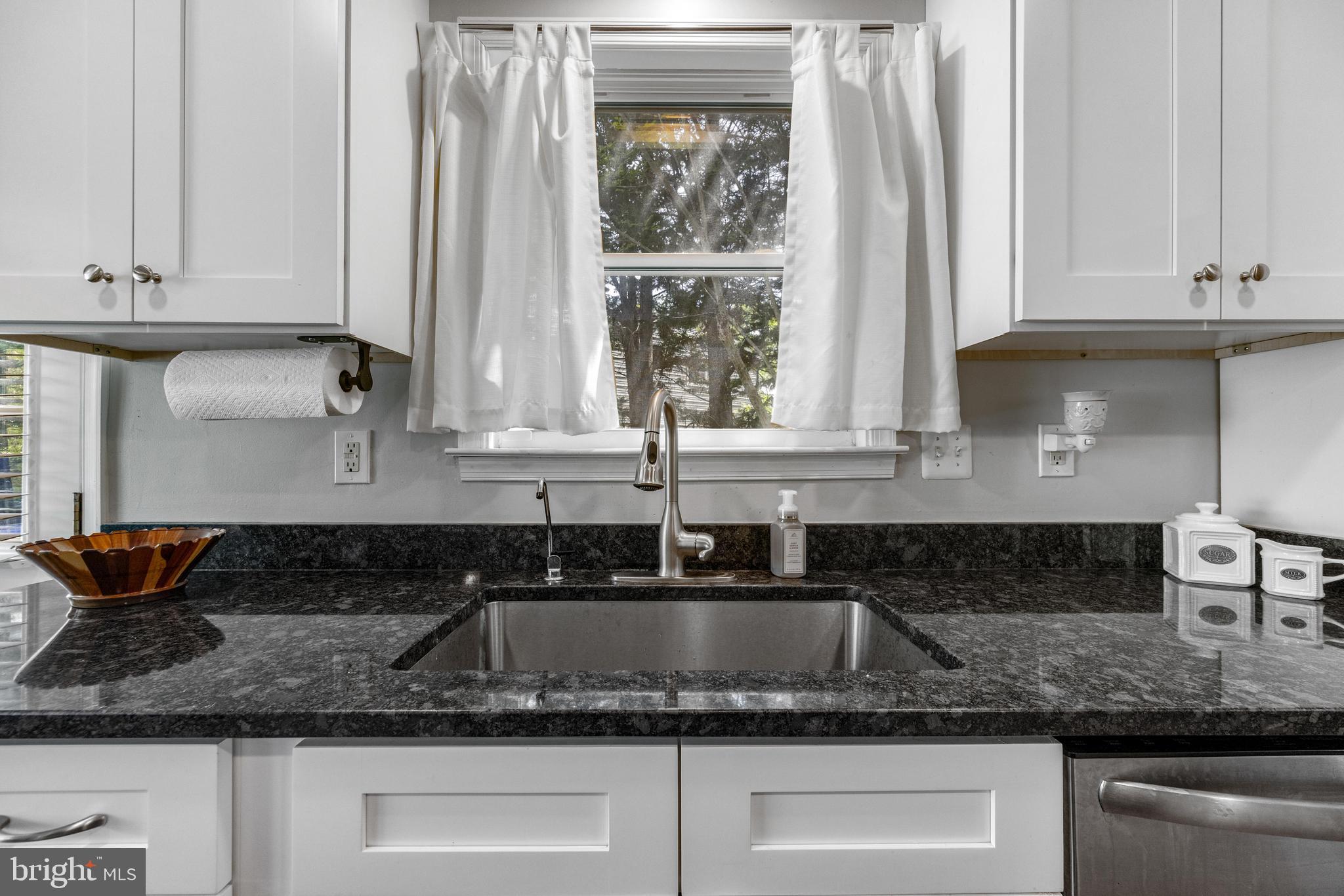 3006 Bass Place Riva, MD 21140 - Photo 9 of 51 a kitchen with granite countertop a sink and a white cabinets