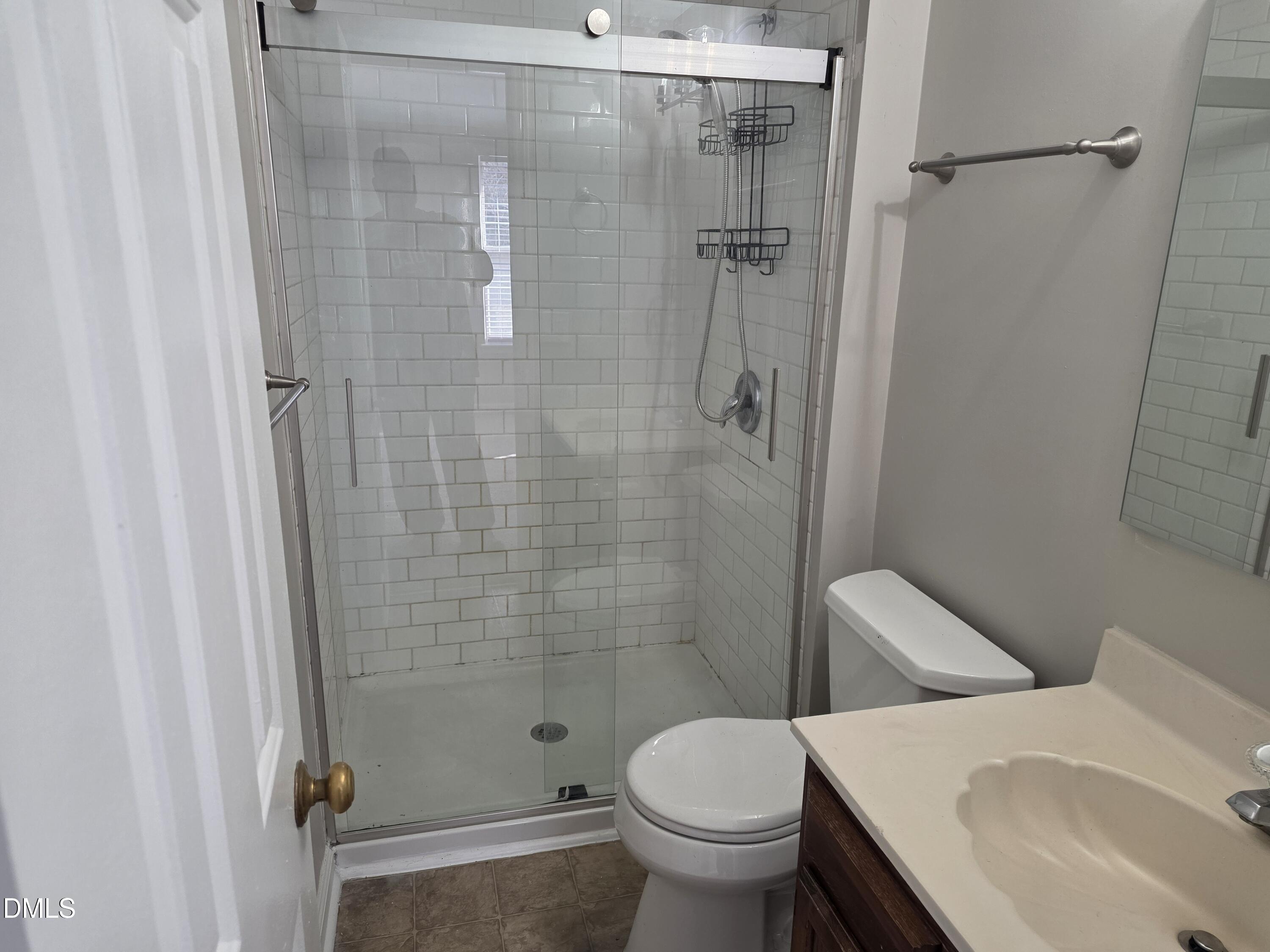 1717 Kayla Court Raleigh, NC 27606 - Photo 12 of 27 a bathroom with a sink and toilet