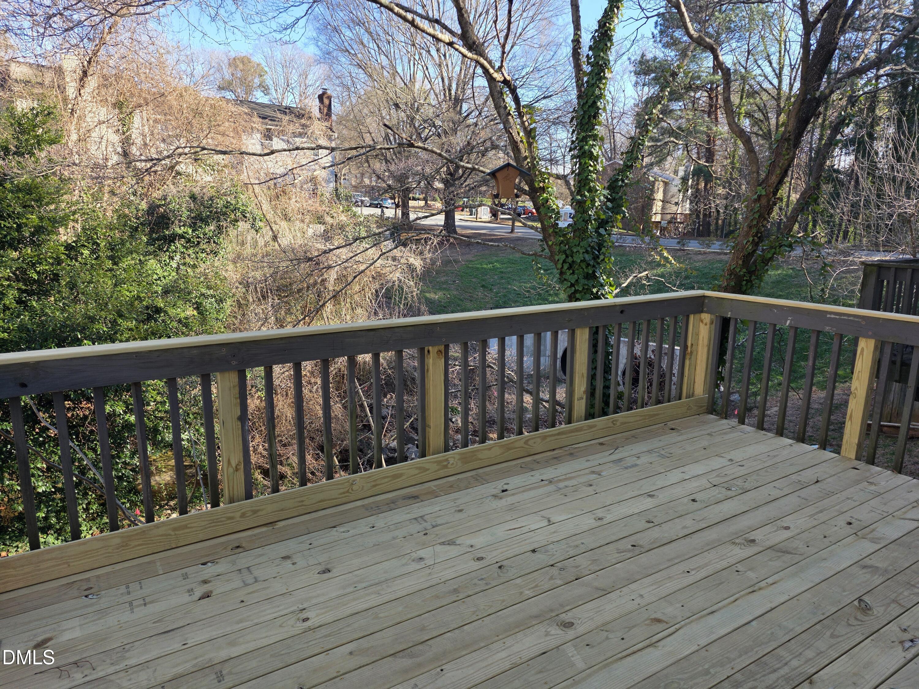 1717 Kayla Court Raleigh, NC 27606 - Photo 13 of 27 a balcony with wooden floor and fence