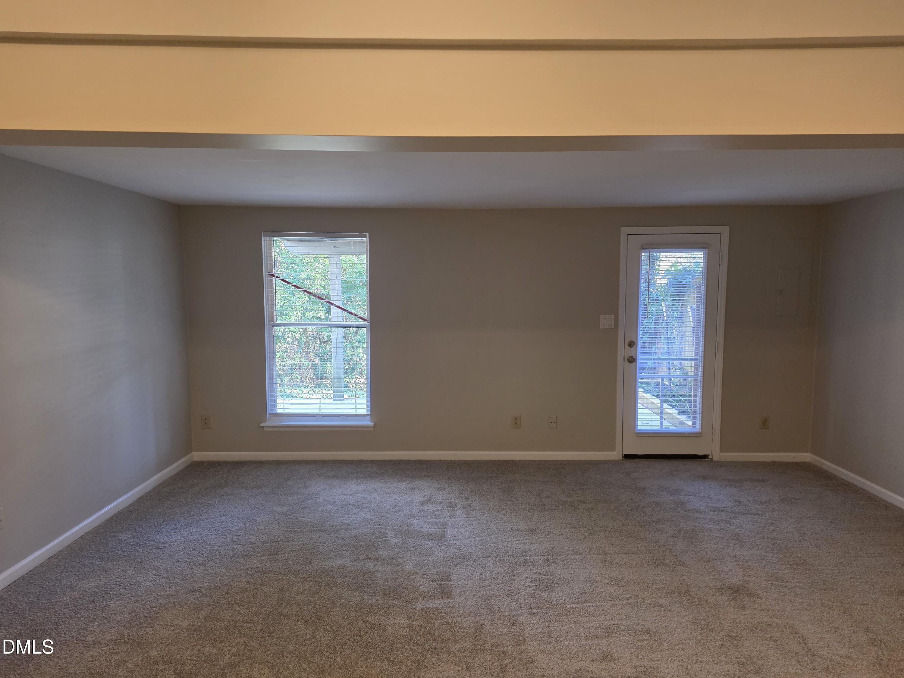 1717 Kayla Court Raleigh, NC 27606 - Photo 17 of 27 a view of an empty room with window