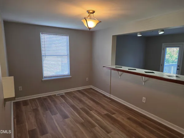 a view of room with window and ceiling fan