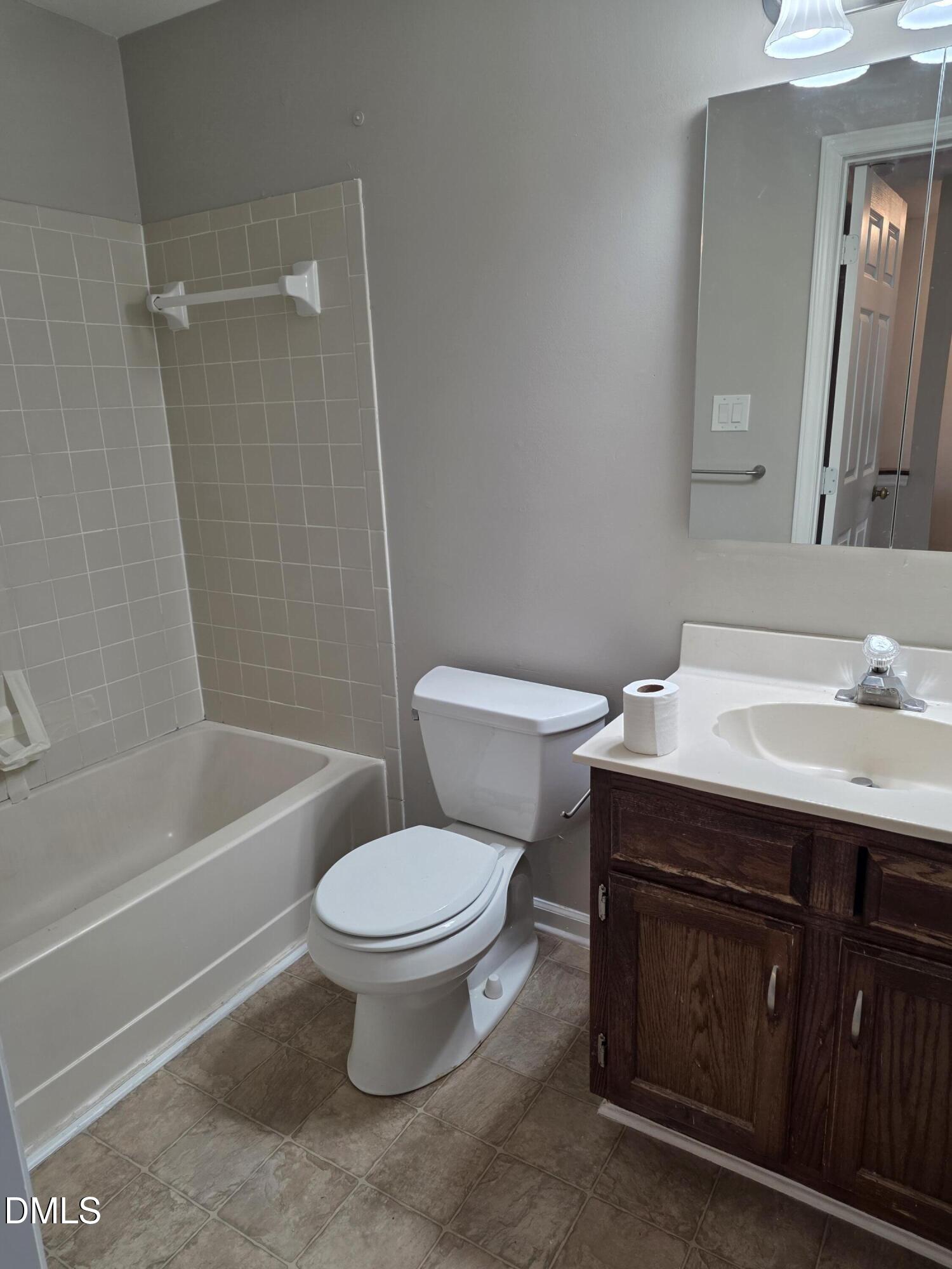 1717 Kayla Court Raleigh, NC 27606 - Photo 10 of 27 a bathroom with a sink toilet and shower