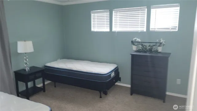 a room with a bed and a window