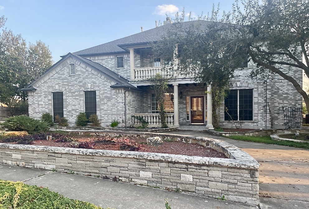 1103 Seton Hall Lane Pflugerville, TX 78660 - Photo 1 of 32 View of front of property featuring a balcony and circle driveway.