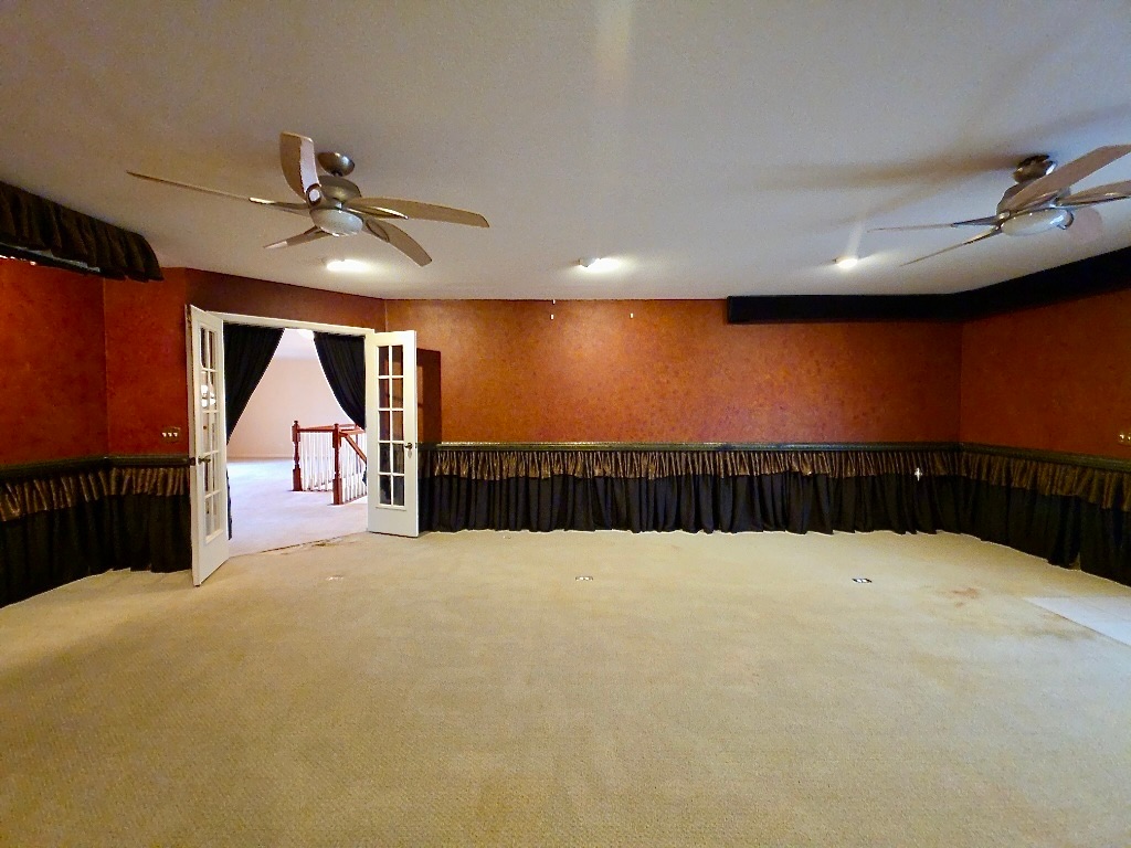 1103 Seton Hall Lane Pflugerville, TX 78660 - Photo 26 of 32 Bonus Room for additional living, media room, or game room with access to second floor balcony with stairs to backyard.