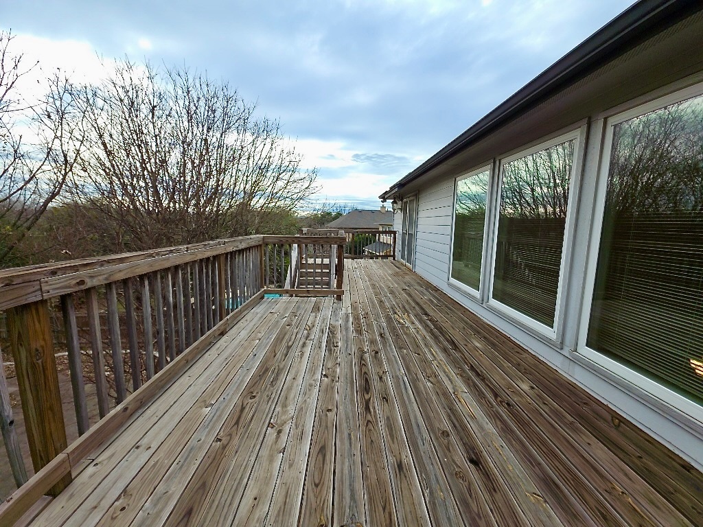 1103 Seton Hall Lane Pflugerville, TX 78660 - Photo 27 of 32 View of wooden balcony from the bonus room with views to backyard