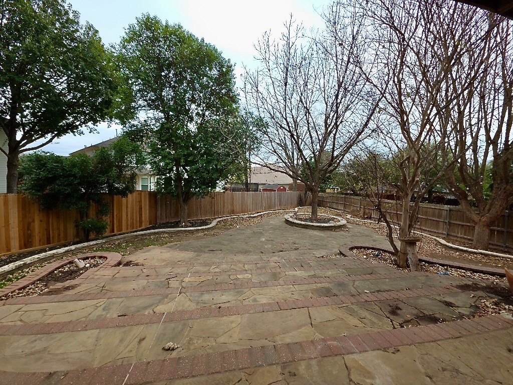 1103 Seton Hall Lane Pflugerville, TX 78660 - Photo 30 of 32 Fenced backyard with a patio area