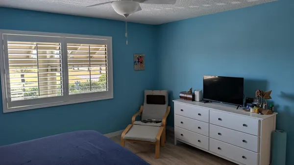 a room with furniture and flat screen tv