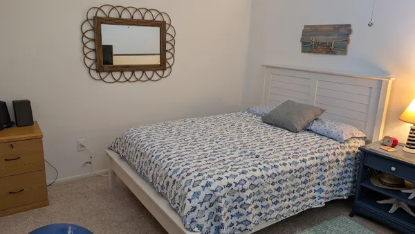 a bedroom with bed and a window