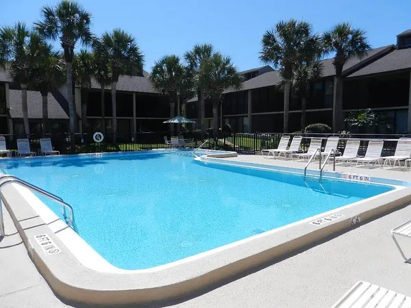 a view of a swimming pool with a patio
