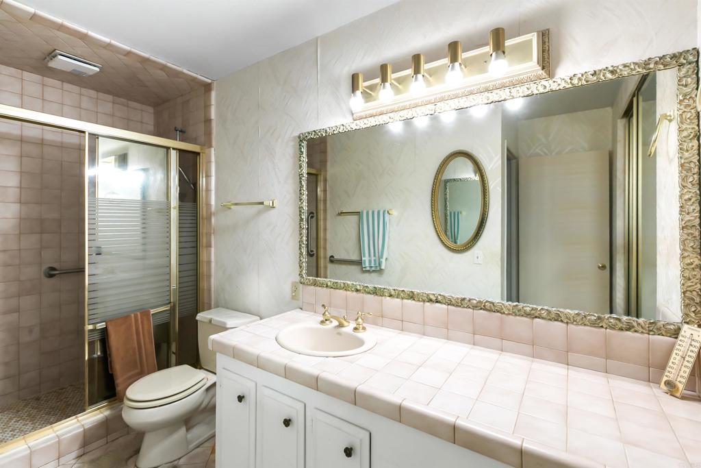 28721 Lebanon Road Pine Valley, CA 91962 - Photo 32 of 48 a bathroom with a toilet sink and mirror