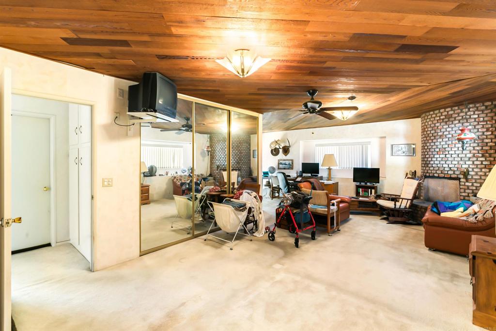 28721 Lebanon Road Pine Valley, CA 91962 - Photo 34 of 48 a living room with lots of furniture and a chandelier