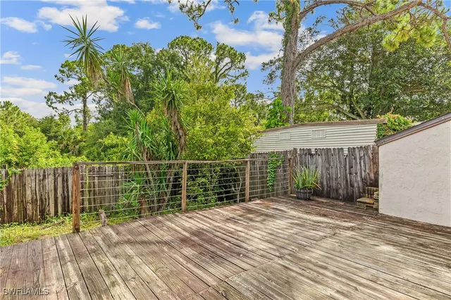 a view of a backyard with a small cabin