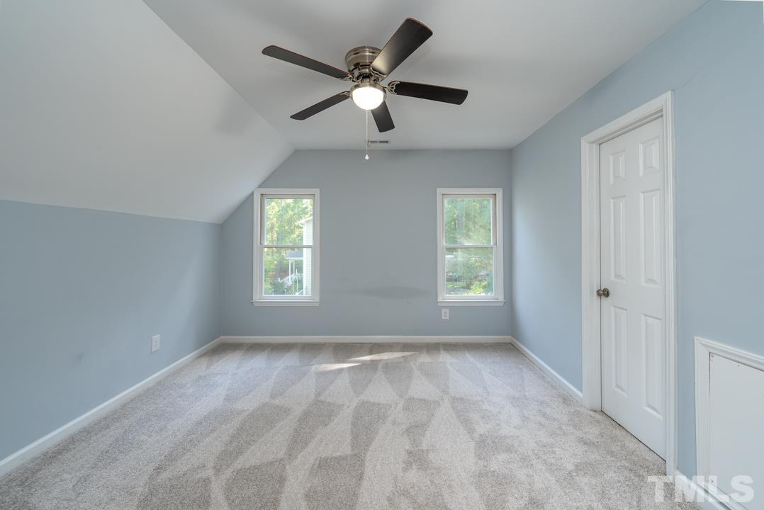 507 Valley Drive Durham, NC 27704 - Photo 16 of 29 a view of room with a ceiling fan
