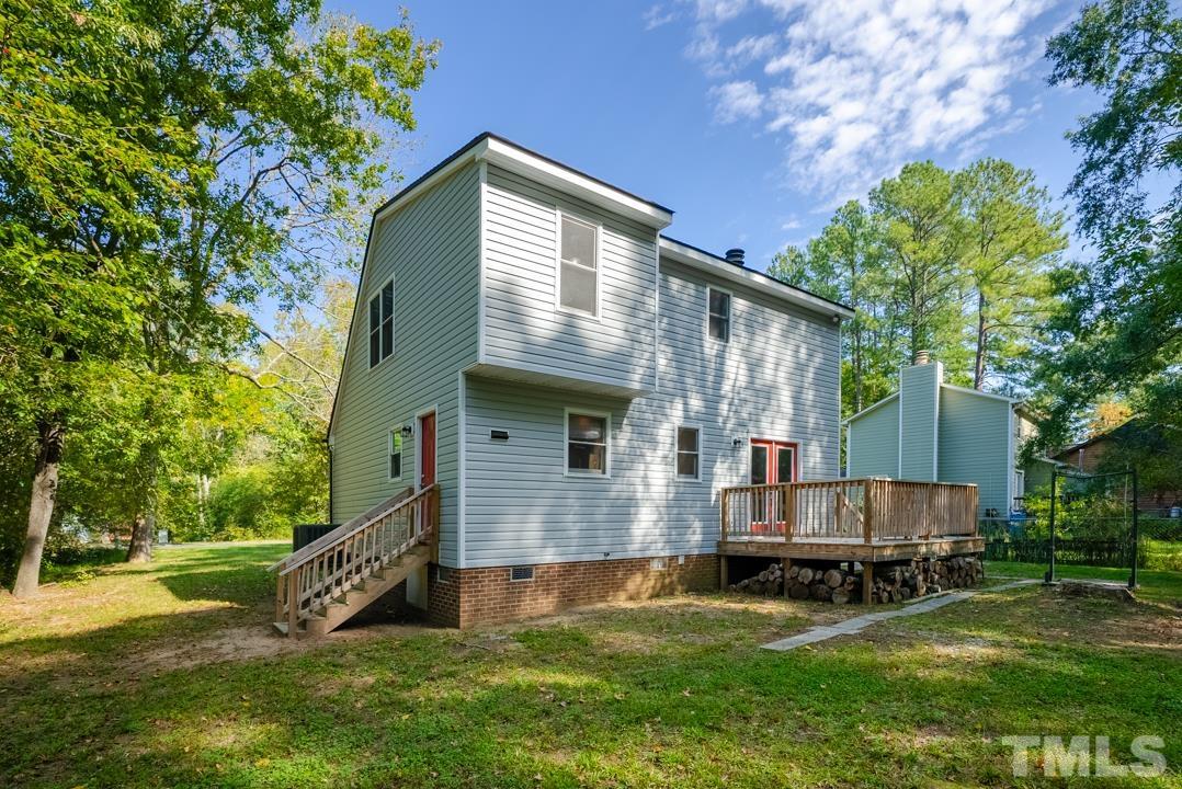 507 Valley Drive Durham, NC 27704 - Photo 25 of 29 a view of backyard with a garden and deck